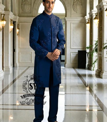 This Admiral Blue sherwani redefines elegance with its intricately executed tone-on-tone adah work, exuding a royal aura with a distinctive modern edge, embodying royal sophistication yet suited to the modern man.