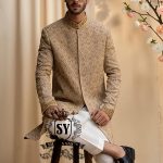 The signature elegance of the modern groom. A Sherwani suit that combines style, tradition, and premium tailoring. This elegant Bright Wood Sherwani dress blends timeless elegance with exquisite artistry, featuring beautiful embroidery that speaks of tradition and modern luxury.