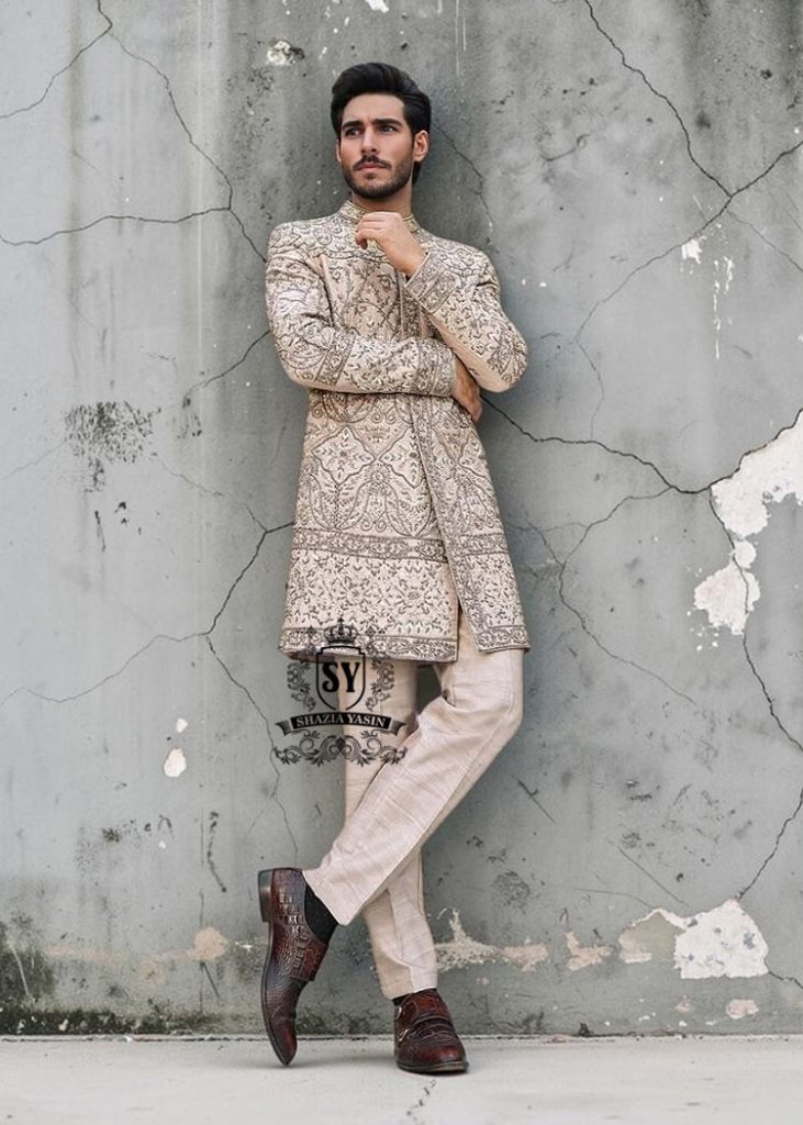 This Sherwani dress will charm everyone with its elegance and exquisiteness. The Blanched Almond color adds a touch of brightness, and beautiful jeweled work border on the front and along the hem creates a feeling of luxury and sophistication.