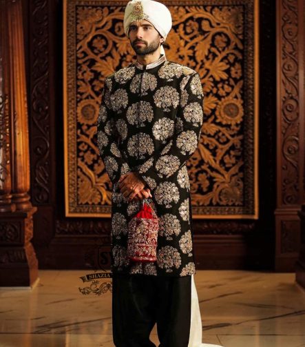 We love the striking contrast of the hand embellished sherwani and premium raw silk, which adds a touch of sophistication. The perfectly tailored cut create a spectacular silhouette for the groom seeking radiant and memorable elegance. An ultra-elegant and graceful look, perfect for a truly gentle wedding day.