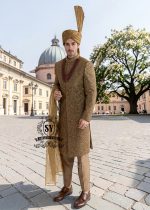 For the noble groom, a sophisticated and sharp Quartz Ochre sherwani, crafted from luxurious masoori net and adorned with exquisite jewels and timeless Zari embroidered floral motifs, was layered over a Quartz Ochre colored kurta set.