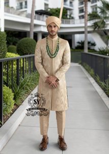 In the grandeur of royal legacy, this Taupe Gold sherwani stands as a tribute to timeless nobility. Handcrafted with intricate embroidery that echo strength and majesty, it glimmers with the delicate artistry of sequins, Swarovski crystals. A creation where tradition meets elegance - designed for the groom who carries the spirit of heritage with the poise of modern royalty.