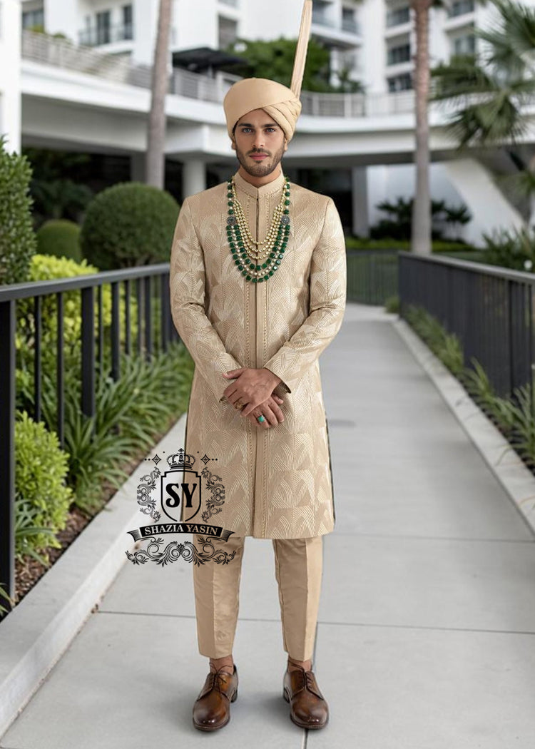 Sherwani216a In the grandeur of royal legacy, this Taupe Gold sherwani stands as a tribute to timeless nobility. Handcrafted with intricate embroidery that echo strength and majesty, it glimmers with the delicate artistry of sequins, Swarovski crystals. A creation where tradition meets elegance - designed for the groom who carries the spirit of heritage with the poise of modern royalty.