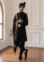This men's wedding Sherwani is the perfect choice for the groom who wants a refined, modern, and impeccable look on his most important day. The tailored black Sherwani suit elegantly accentuates his figure, while the classic  shawl adds a unique and sophisticated touch.