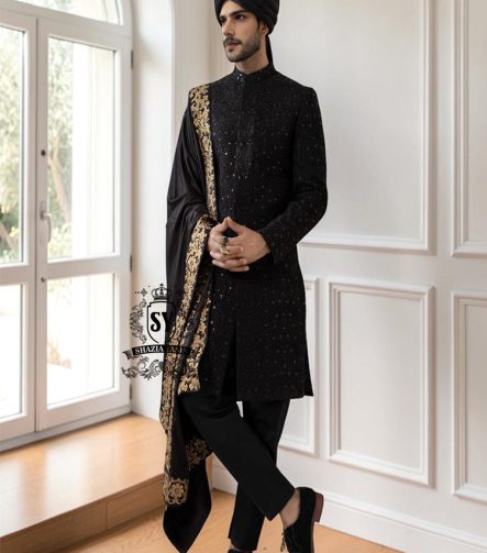 This men's wedding Sherwani is the perfect choice for the groom who wants a refined, modern, and impeccable look on his most important day. The tailored black Sherwani suit elegantly accentuates his figure, while the classic  shawl adds a unique and sophisticated touch.