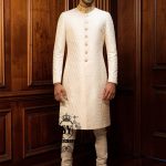 Elegant, slim-fit Off-White men's wedding Sherwani suit. A modern men's formal Sherwani suit perfect for contemporary weddings, stylish ceremonies, elegant Nikah events, and special occasions.