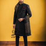 Wrapped in a rich black Sherwani with lustrous Self-embroidery and precise tailoring, this Sherwani defines luxury. A perfect balance of refinement, confidence and iconic black.