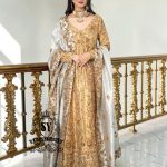 Our radiant Bride shining in the elegant angrakha pishwan, crafted from luxurious silky lame and adorned with exquisite embellishments.⁠ Let this gold outfit accentuate your captivating beauty!