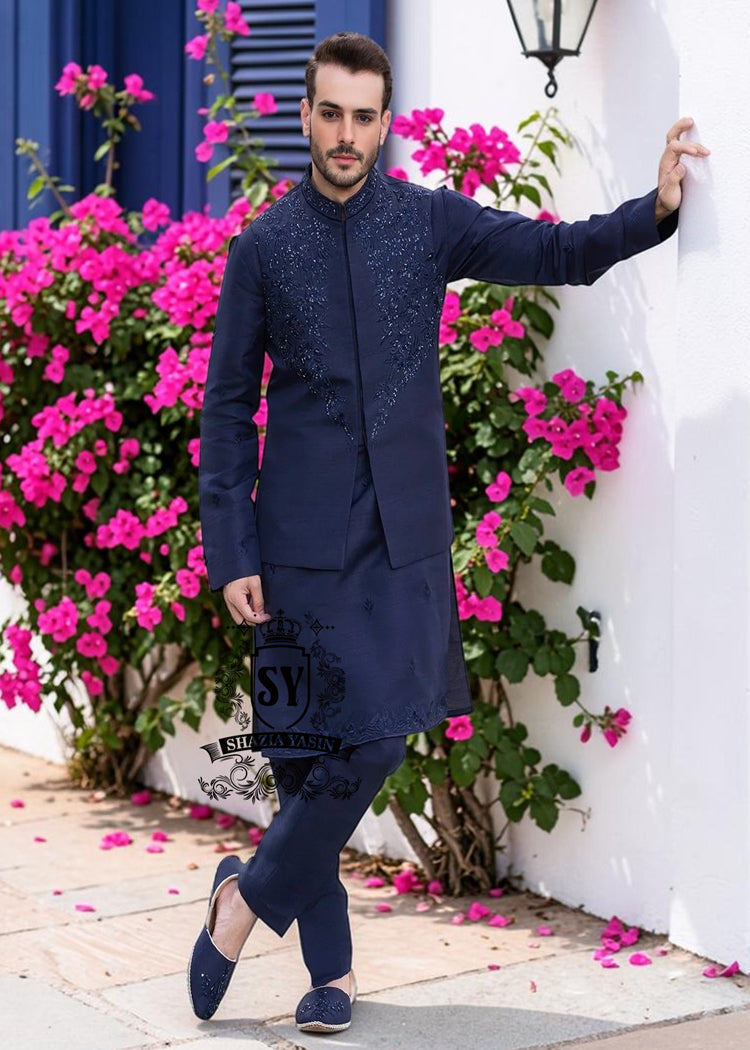 Waistcoat125A A stylish waistcoat crafted from luxurious navy blue raw silk fabric. The waistcoat itself, the front, and the sleeves are adorned with intricate threadwork and embroidery, giving it a refined and traditional feel.