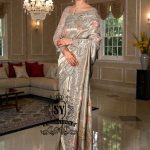 Designer Couture Saree Wedding dress with an open Back Blouse adorned with 3D flowers and a soft pleated Saree