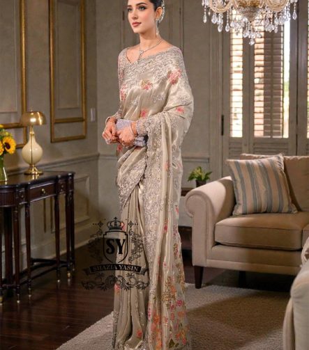 Designer Couture Saree Wedding dress with an open Back Blouse adorned with 3D flowers and a soft pleated Saree