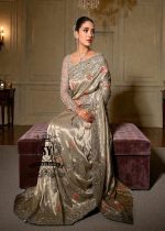 Designer Couture Saree Wedding dress with an open Back Blouse adorned with 3D flowers and a soft pleated Saree